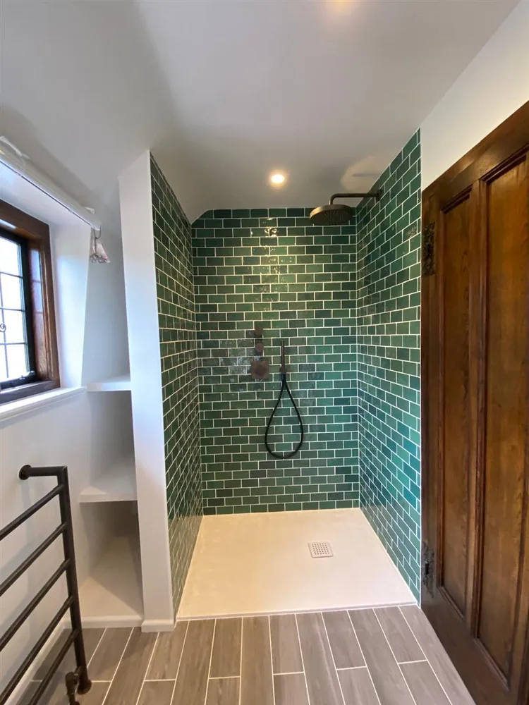 Bottle-green metro tiled walk-in shower