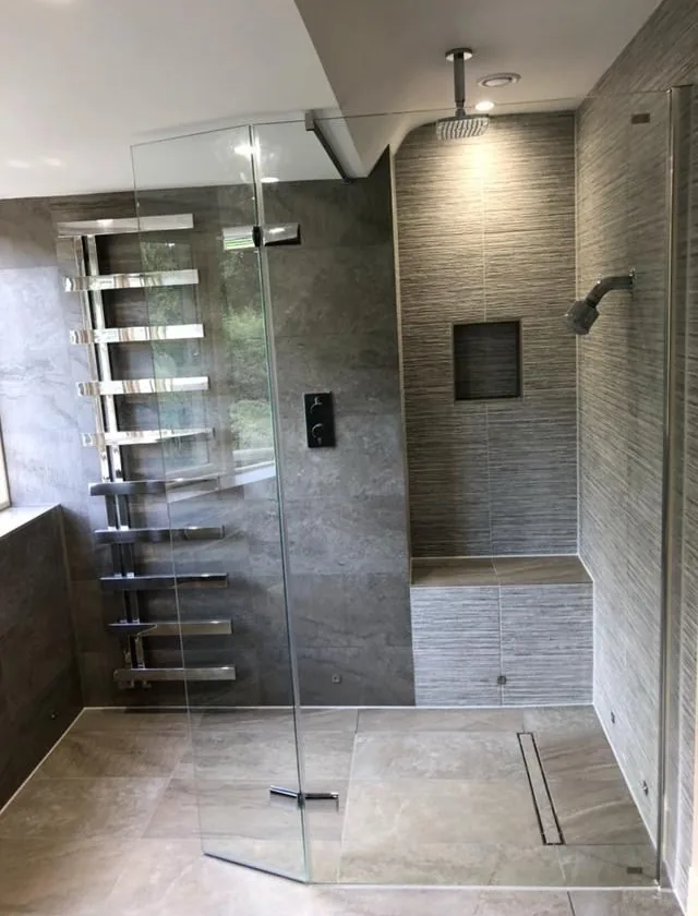 Frameless walk-in wet room with rainfall head